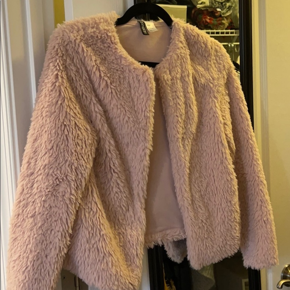 Pink fuzzy coat.